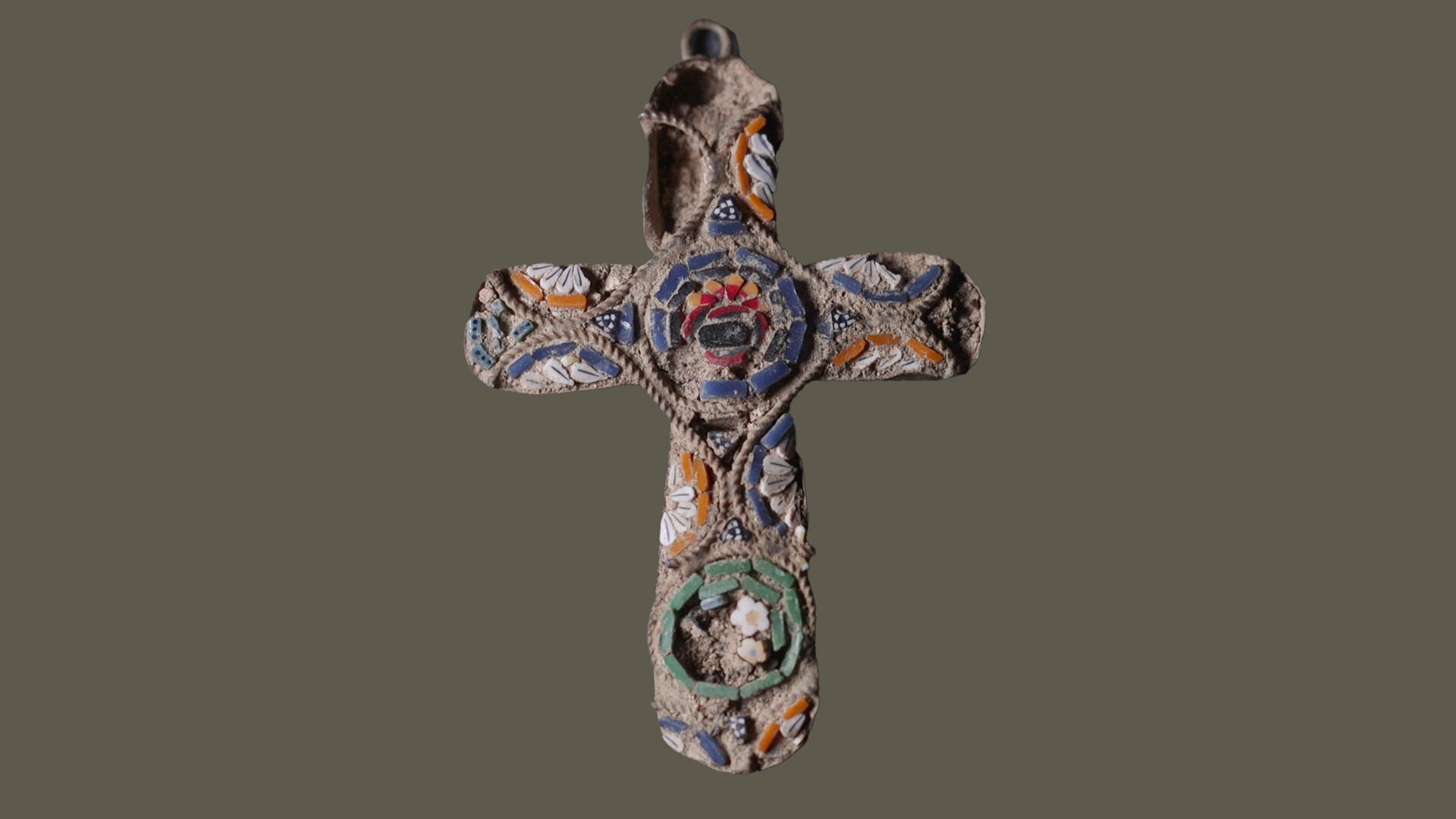 Child finds a 100-year-old cross pendant likely lost by pilgrim